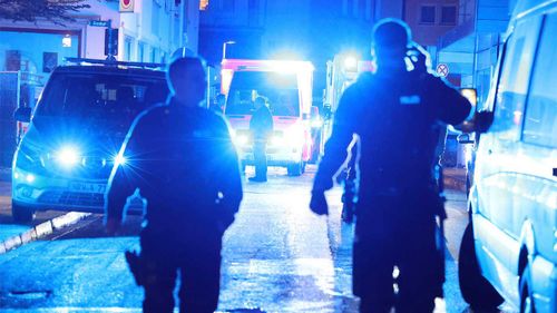 Police and ambulances near the scene where people were killed and injured in an attack at a festival in Solingen.