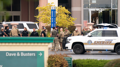 Members of law enforcement gather outside Columbiana Centre mall in Columbia, S.C., following a shooting, April 16, 2022. 