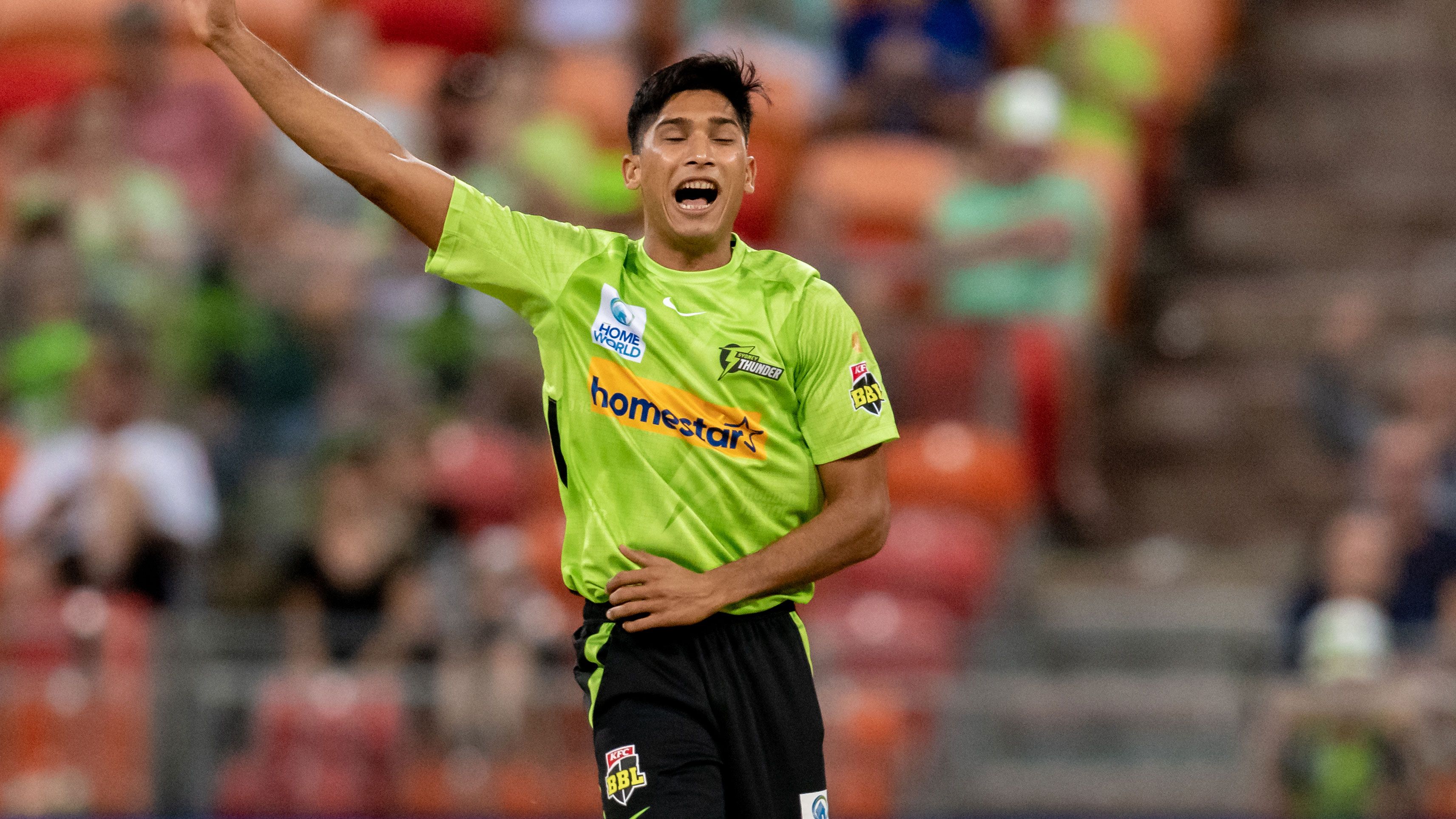 Sydney Thunder bowler Mohammad Hasnain celebrates after taking a wicket against Adelaide Strikers. 