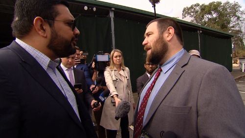 Islamic Council spokesman Ali Kadri confronts Mr Robertson after he arrived at a mosque.