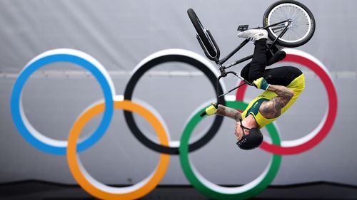 BMX athlete Logan Martin of Australia in action in front of the Olympic rings