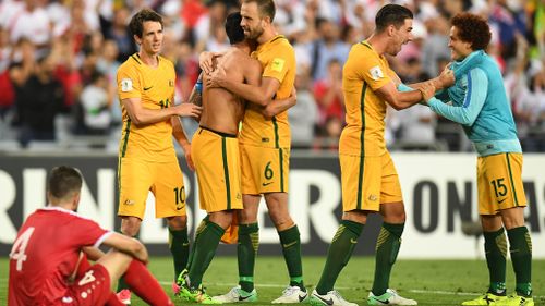 The Socceroos celebrate their win over Syria. (AAP)