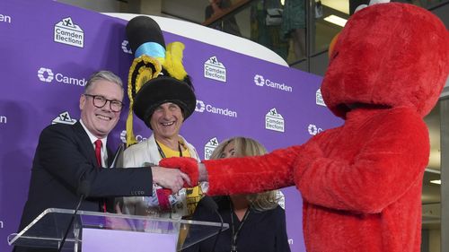 Keir Starmer with someone dressed as Elmo and other candidate for his local constituency