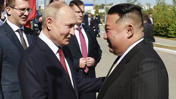 Russian President Vladimir Putin and North Korea&#x27;s leader Kim Jong-un shake hands during their meeting at the Vostochny cosmodrome.