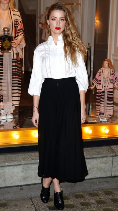 <p>In a Temperley London shirt and skirt.</p>