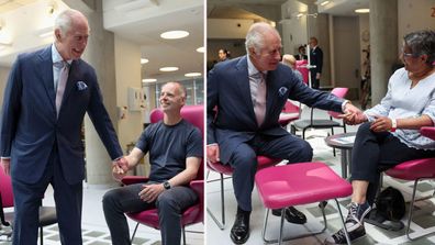 King holds hands of cancer patients during poignant return to public duties after diagnosis