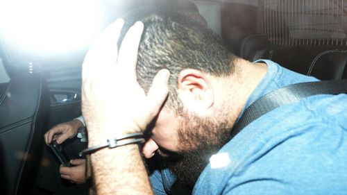 Omar Succarieh is brought to the Brisbane Police Watchhouse, Wednesday, Sept 10. (AAP)