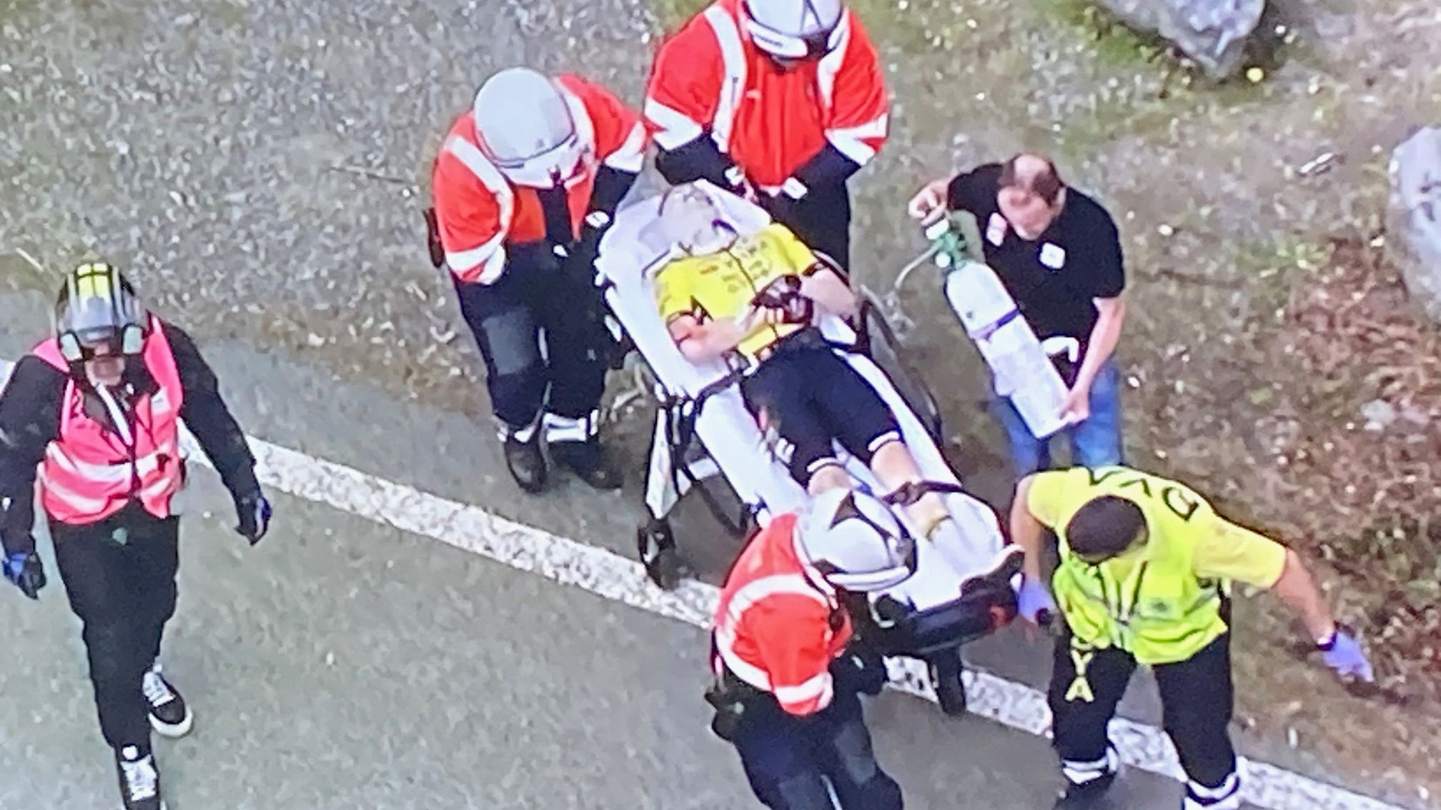 Jonas Vingegaard is taken away from the crash site.