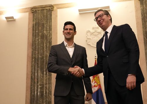 Serbian tennis player Novak Djokovic, left, shakes hands with Serbia's President Aleksandar Vucic in Belgrade, Serbia, Thursday, Feb. 3, 2022.