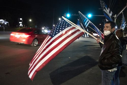 Supporters of President Donald Trump demonstrate at the entrance to Walter Reed National Military Medical Center 