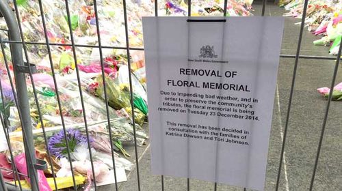 Volunteers from the Red Cross, Rural Fire Service and State Emergency Service will assist City of Sydney staff in collecting the flowers that have been placed in the past week. (ninemsn/Hal Crawford)