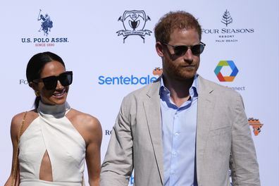 Britain's Prince Harry, right, and wife Meghan Markle, Duchess of Sussex, arrive for the 2024 Royal Salute Polo Challenge to Benefit Sentebale