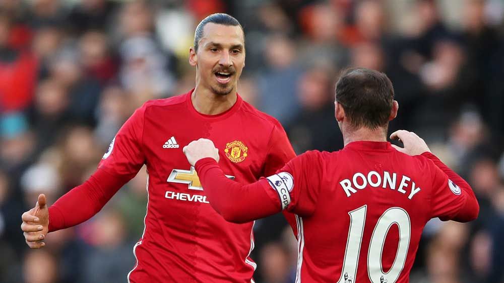 Manchester United striker Zlatan Ibrahimovic celebrates his goal with Wayne Rooney. (AAP)