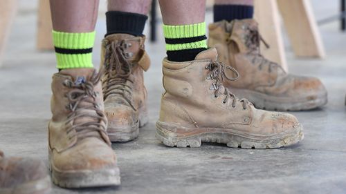 Apprentices wearing work boots are seen at Holmesglen TAFE Chadstone campus in Melbourne, Monday, May 15, 2017. (AAP)