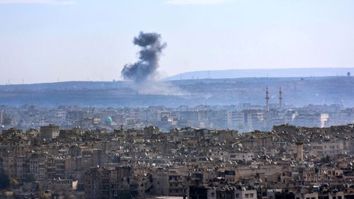 A general view taken from the government-held side of Aleppo shows smoke billowing from the southern suburbs during fighting between regime forces and rebel fighters on December 3, 2016. (AFP)