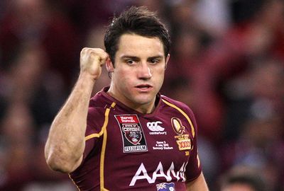 Cooper Cronk celebrates after kicking a field goal to win the 2012 series.