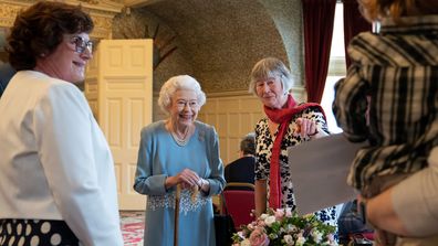 Queen Elizabeth attends a reception with representatives from local community groups to celebrate the start of the Platinum Jubilee, in the Ballroom of Sandringham House on February 5, 2022