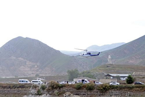 In this photo provided by Islamic Republic News Agency, IRNA, the helicopter carrying Iranian President Ebrahim Raisi takes off at the Iranian border with Azerbaijan.