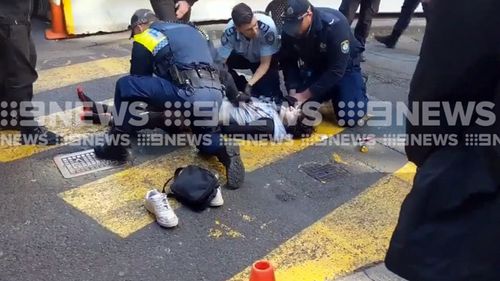 NSW Police arrest the alleged attacker, who caused mass panic in Sydney's CBD.