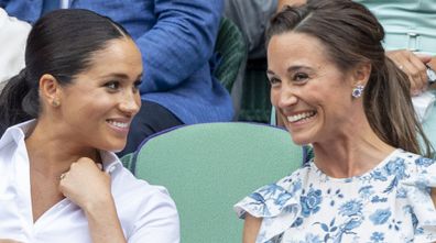 Catherine, Duchess of Cambridge and Meghan, Duchess of Sussex and Pippa Middleton in the Royal Box at Wimbledon on July 13, 2019 in London, England.