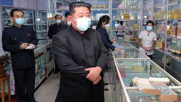 In this photo provided by the North Korean government, North Korean leader Kim Jong Un, centre, visits a pharmacy in Pyongyang, North Korea.