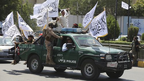 Taliban fighters celebrate the third anniversary of the withdrawal of US-led troops from Afghanistan, in Kabul, Afghanistan, Wednesday, August 14, 2024.