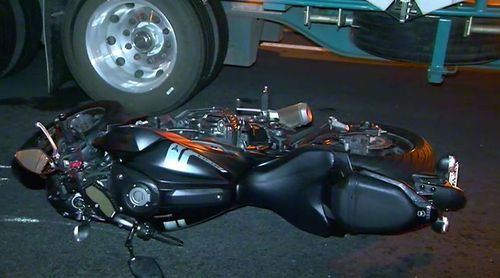 A motorbike rider has died after he collided with a car and a truck in Melbourne's west. Picture: 9NEWS