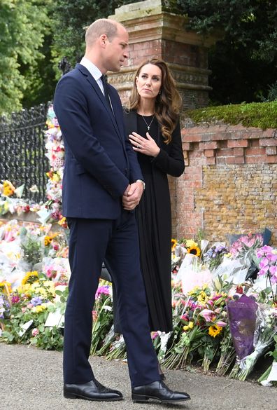 Prince William, Prince of Wales and Catherine, Princess of Wales, view floral tributes placed outside the Sandringham Estate following the death of Queen Elizabeth II, on September 15, 2022 in King's Lynn, England.  