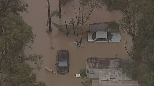 The Georges River has broken its banks, flooding suburbs in Sydney's southwest. (9NEWS)