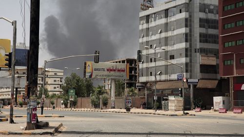 Smoke is seen rising from a neighborhood in Khartoum, Sudan, Saturday, April 15, 2023.  