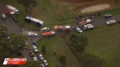 A school bus and a truck collided in a small town west of Melbourne, causing the bus to roll.