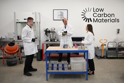 Prince William, Prince of Wales (C) is shown part of the low carbon concrete manufacturing process, as he talks with CEO and Co-founder Natasha Boulding, during his visit to Low Carbon Materials to learn more about how they are working to create low-carbon construction material alternatives since becoming a 2022 Earthshot Prize Finalist on April 30, 2024 in Seaham, England 