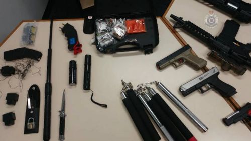 Numerous weapons and replica firearms were found in the raids.