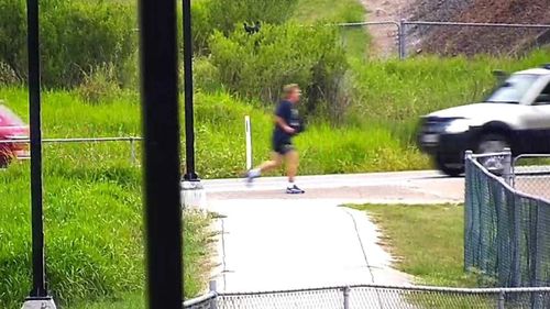 Neil Bennett is seen running down a road before his death.