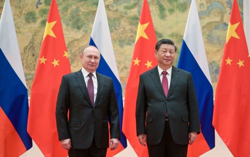 Russia's President Vladimir Putin (L) and his Chinese counterpart Xi Jinping pose during a meeting on February 4, 2022. Alexei Druzhinin/Russian Presidential Press and Information Office/TASS