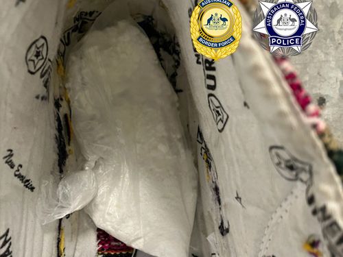 Two men have been sentenced after trying to smuggle 100 grams of cocaine into the Northern Territory, hidden inside sneakers.
