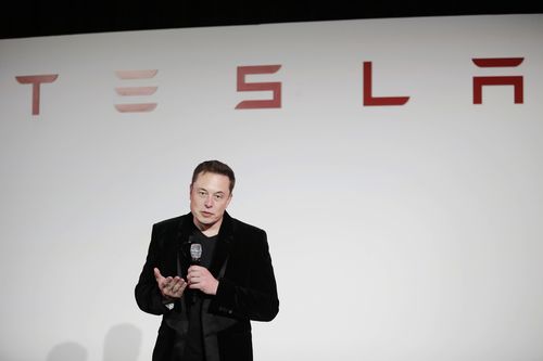 Elon Musk, CEO of Tesla Motors Inc., talks about the Model X car at the company's headquarters  Tuesday, Sept. 29, 2015, in Fremont, California.