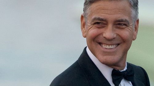 Clooney wore an Armani tuxedo, grinned and rubbed his hands in glee as he arrived to the Aman hotel in Venice. (AAP)