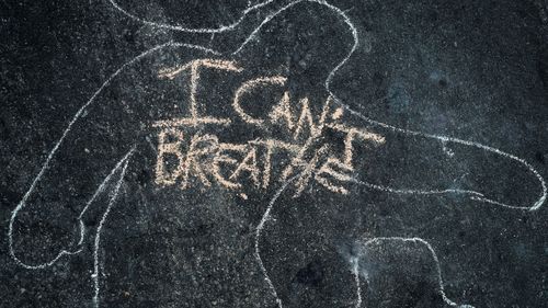'I Can't Breathe' is scrawled on the pavement outside the District Attorney's office in Los Angeles, California during a peaceful demonstration over George Floyd's death. 