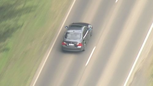 The luxury BMW has been involved in a high-speed chase for almost an hour (9NEWS)