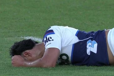 Zarn Sullivan lays on the ground after suffering an injury in the Blues vs Hurricanes match.