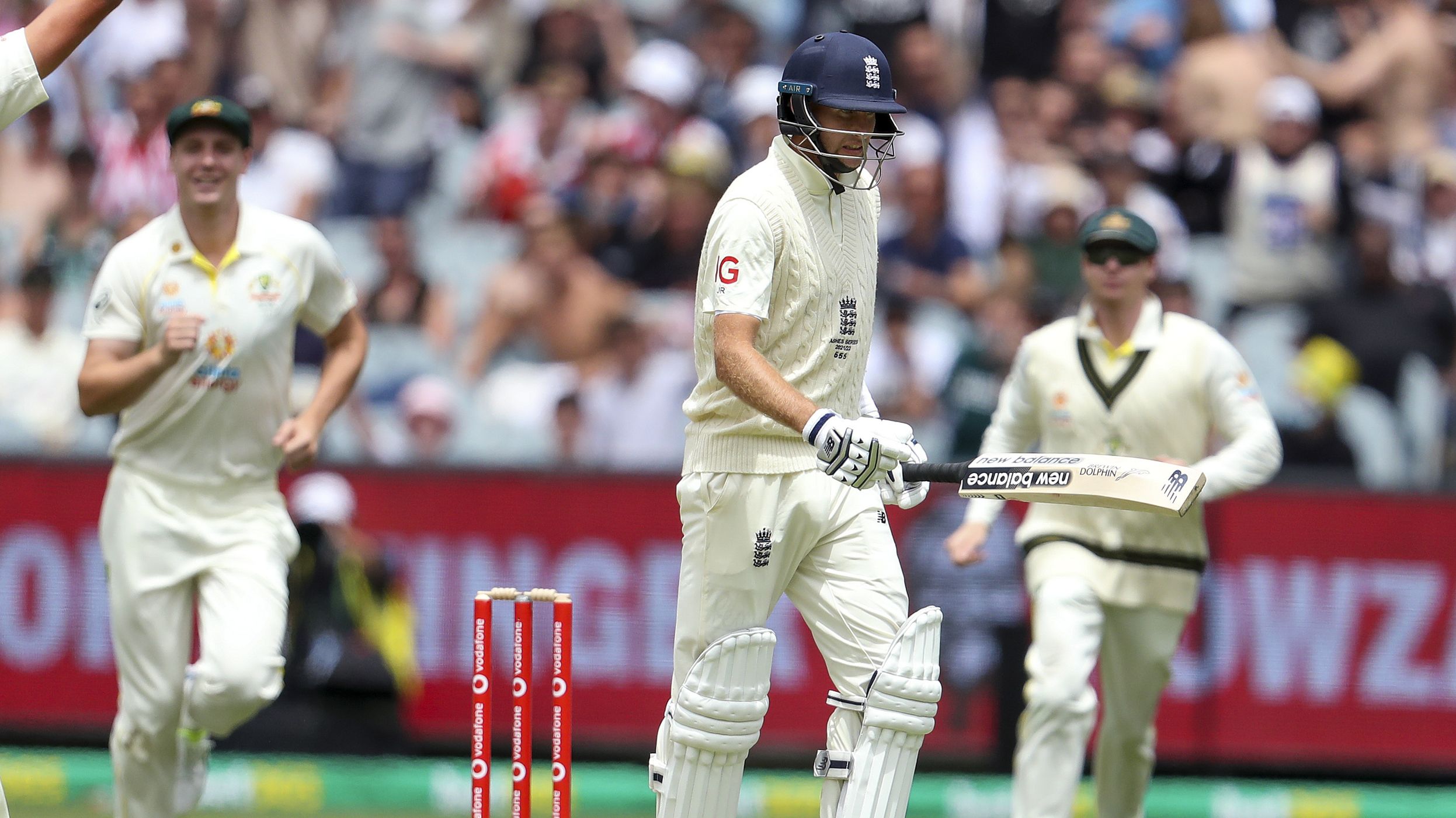 Australia&#x27;s Mitchell Starc, left, celibates the wicket of England&#x27;s Joe Root.