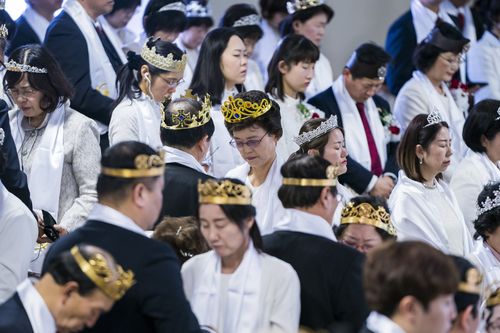 The ceremony is meant to be a blessing of couples and their devotion to the AR-15 rifle. (AAP)