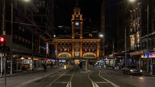 Streets of Melbourne's CBD lie empty as a lockdown curfew takes effect.
