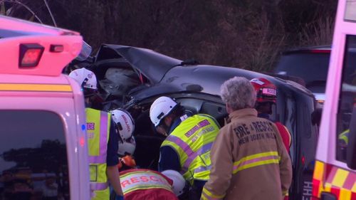 Mr Hellouc was trapped in his car for more than an hour before being freed by rescue workers. (9NEWS)