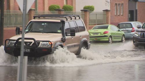 Roads have flooded in Marrickville.