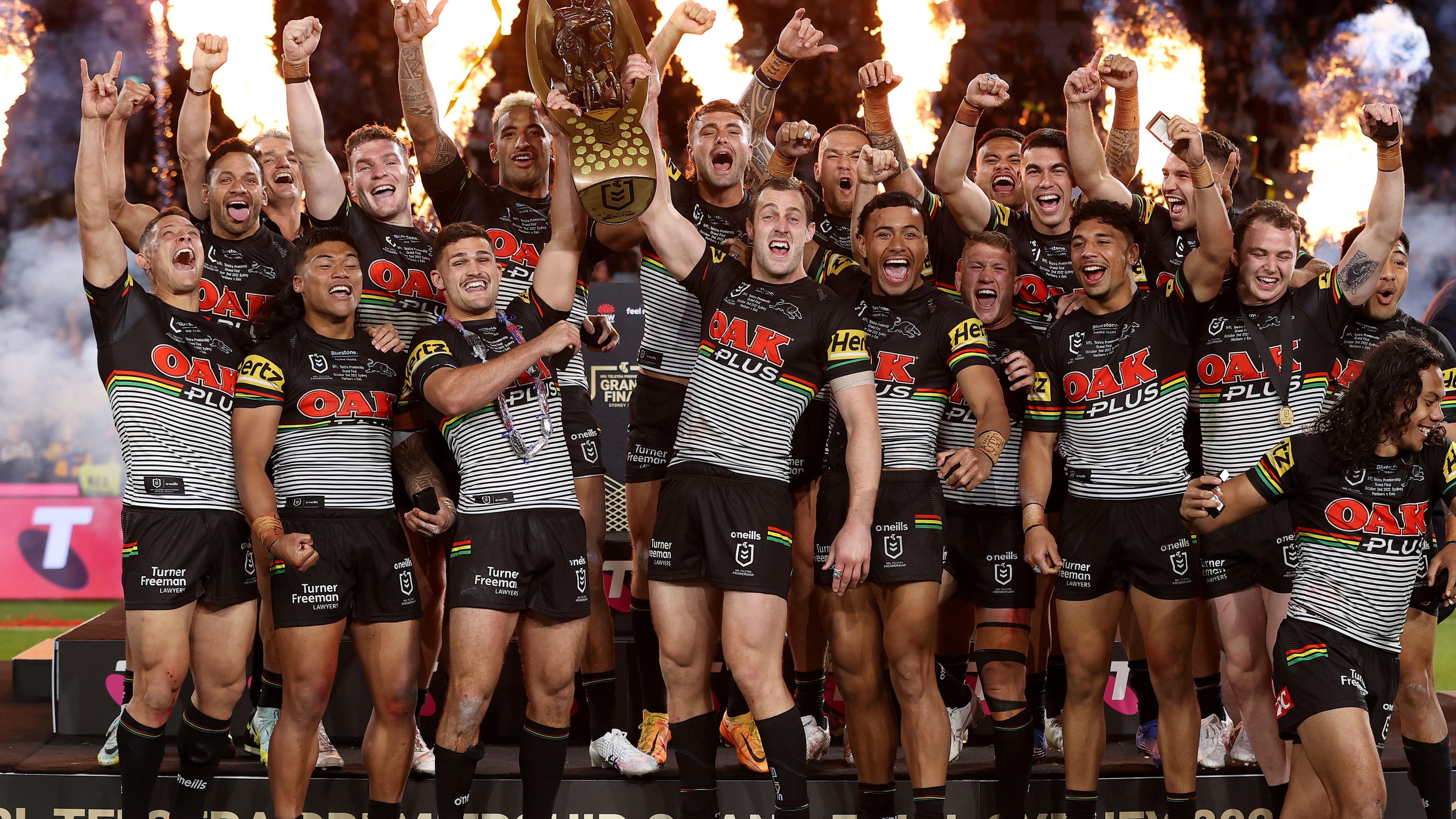 The Panthers celebrate with the NRL Premiership Trophy after victory in the 2022 NRL grand final.