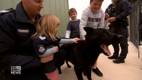 Isla was given the chance to ride the police horses and watch them train, and greet the dogs.