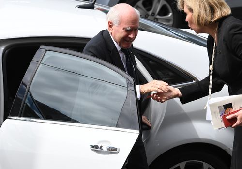ormer prime minister John Howard arrives for the State Funeral.