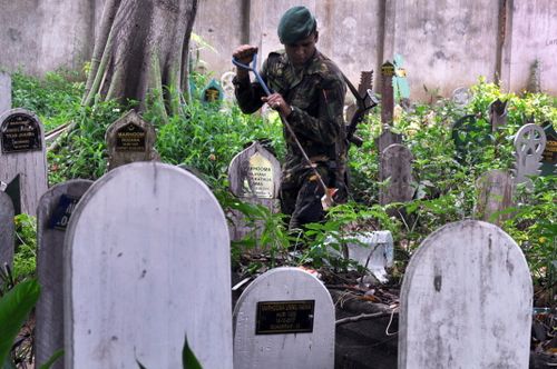 The remains of a suicide bomber who attacked a church in eastern Sri Lanka on Easter Sunday have been exhumed after protests demanding they be moved from a local cemetery.